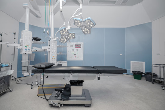 background of hospital empty operation room with surgery bed and surgery light