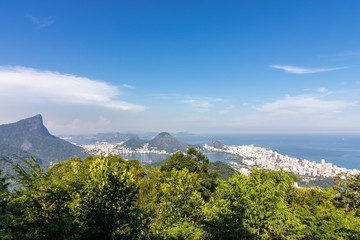 Beautiful landscape with rainforest, city district (Leblon, Ipanema, Botafogo), Lagoon Rodrigo de Freitas and mountains (corcovado, sugarloaf, two brothers ) seen from Vista Chinesa in Tijuca Forest, 