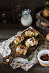 Baked potato with bacon and fresh yogurt