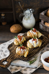 Baked potato with bacon and fresh yogurt