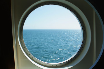 A view from the porthole window of a cruise ship