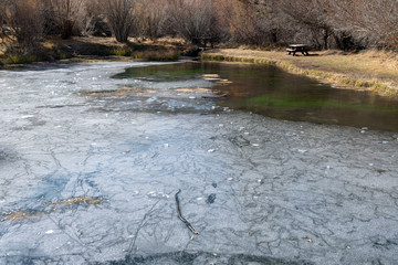 Picnic area by a frozen lake