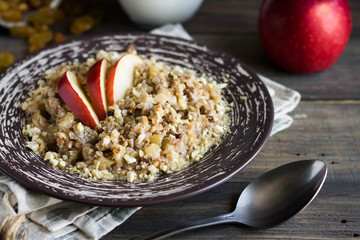 Buckwheat porridge with milk, apple, raisins and cashew nuts