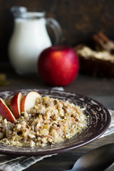 Buckwheat porridge with milk, apple, raisins and cashew nuts