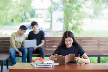 Obraz premium Education first, Beautiful female college student read a book