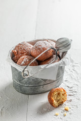Yummy and fresh mini doughnuts with powdered sugar