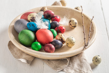 Various eggs for Easter in old clay plate