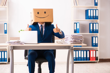 Happy man employee with box instead of his head