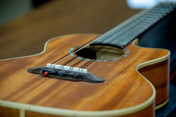 A closeup of an acoustic guitar