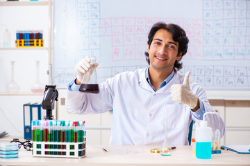 Young chemist working in the lab 
