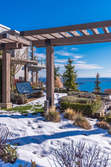 A perfect neighbourhood. Houses in suburb at Winter in the north America. Luxury houses covered nice snow.