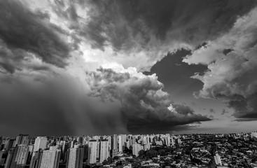 Beautiful view of the dramatic dark stormy sky in black and white. The rain is coming soon. Pattern of the clouds over city. Very heavy rain sky in Sao Paulo city, Brazil South America. 