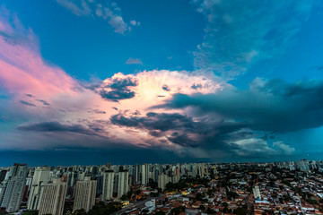 Beautiful view of dramatic dark stormy sky. The rain is coming soon. Pattern of the clouds over city. Very heavy rain sky in Sao Paulo city, Brazil South America. 