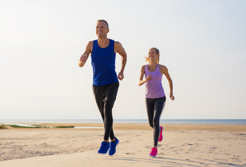 Man and woman exercise outdoors
