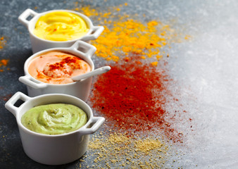 Vegan almonds mayonnaise with wasabi, chilli and turmeric in bowl. Dairy, egg and soy-free