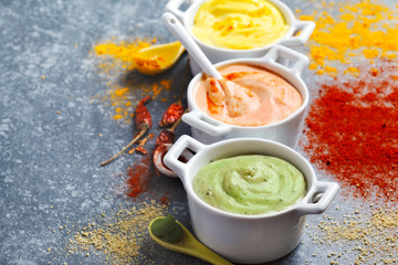 Vegan almonds mayonnaise with wasabi, chilli and turmeric in bowl. Dairy, egg and soy-free