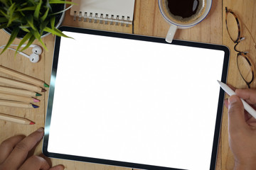 Top view man using tablet device at workspace