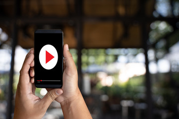 man holding smartphone against VDO ads concept