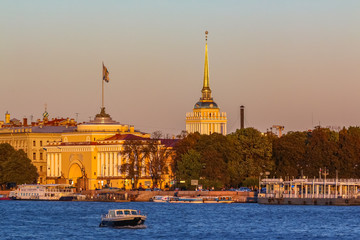 Sunset in Saint Petersburg over the Neva river with the view of the Palace Embankment and the Admiralty or Admiralteystvo spire