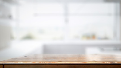 Empty wood counter table in white kitchen room background.