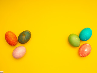 Obraz premium Colorful Easter Eggs On Yellow Background