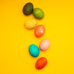 Colorful Easter Eggs On Yellow Background