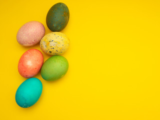 Colorful Easter Eggs On Yellow Background