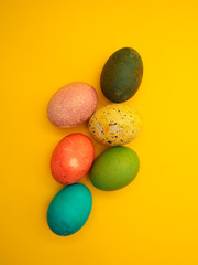 Colorful Easter Eggs On Yellow Background