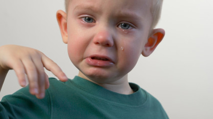 Baby (kid, child, little  boy) is crying. Tears, closeup face, portrait