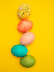 Obraz na płótnie Canvas Colorful Easter Eggs On Yellow Background