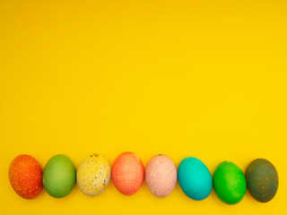 Colorful Easter Eggs On Yellow Background