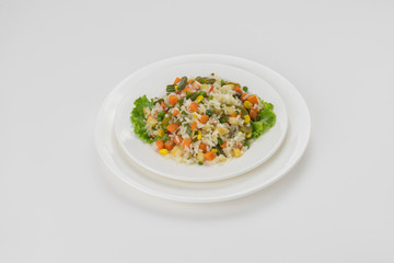 boiled rice vegetables white plate isolated