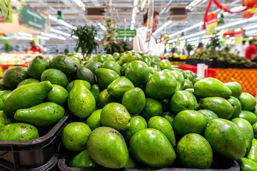 Fresh organic exotic green avocado on a local food market, Bali island. Avocado background.