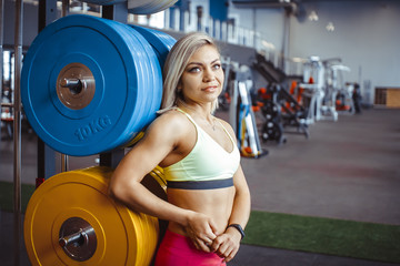 Fototapeta na wymiar girl standing in the gym