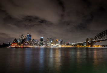 Fototapeta premium Sydney city under clouds at night