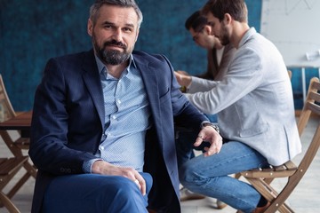 Portrait Of Mature Businessman Working In Office.