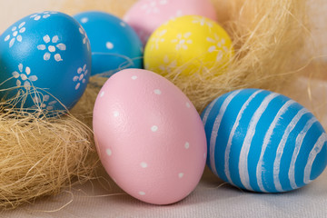Easter eggs with colored eggs in nest