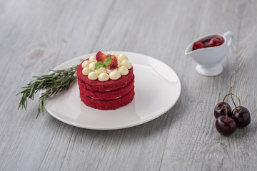 Thai Cake. Velvet red cake. Cookies decorated with red cake on wooden table and flower. strawberries morning. Sweet and sherry. Cherry in the cup. Sweet and Cherry.