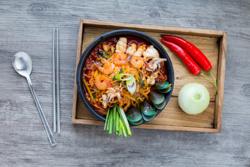 Korean food, Jampong, spicy noodle seafood in black bowl for korean menu style.