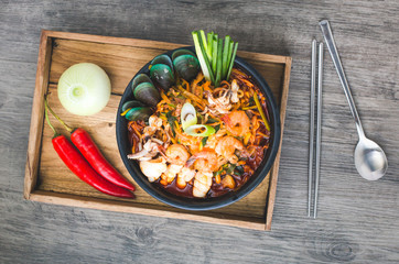 Korean food, Jampong, spicy noodle seafood in black bowl for korean menu style.