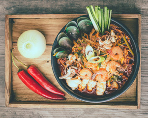 Korean food, Jampong, spicy noodle seafood in black bowl for korean menu style.
