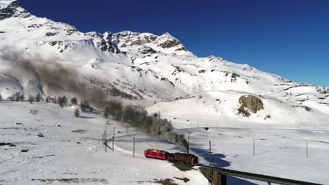 Steam train on the Rhaetian Railway. Bernina Express, Unesco World Heritage