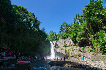 Tegenungan waterfall with blue skies above Kemenuh Village, Sukawati, Gianyar, Bali, Indonesia