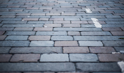 square granite stones on the pavement background