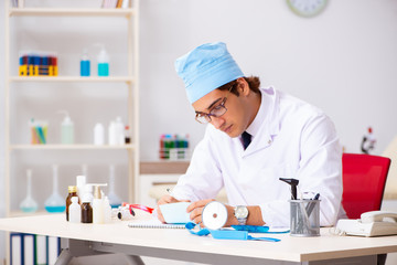 Young male doctor otolaryngologist working at the hospital 