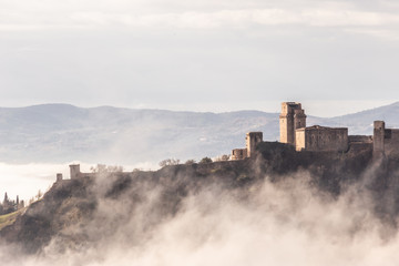 A view of Rocca Maggiore castle in Assisi (Umbria, Italy) in the middle of fog