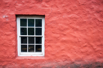 white window and red wall background 