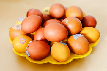 painted with natural dye Easter eggs on plate