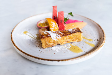 Close up of yummy french toast with fresh fruits.