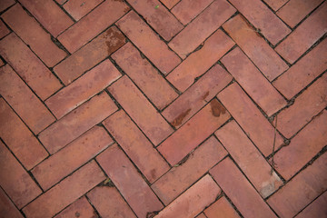 Red brick paving stones on a sidewalk